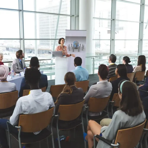 businesswoman-speaking-in-front-of-business-people-2026-01-09-11-06-56-utc (1) (1)