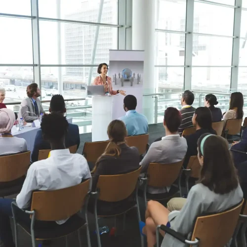 businesswoman-speaking-in-front-of-business-people-2026-01-09-11-06-56-utc (1) (1)